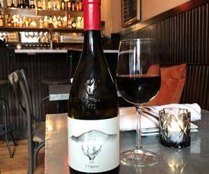 Bottle and glass of Etna Rossa wine
